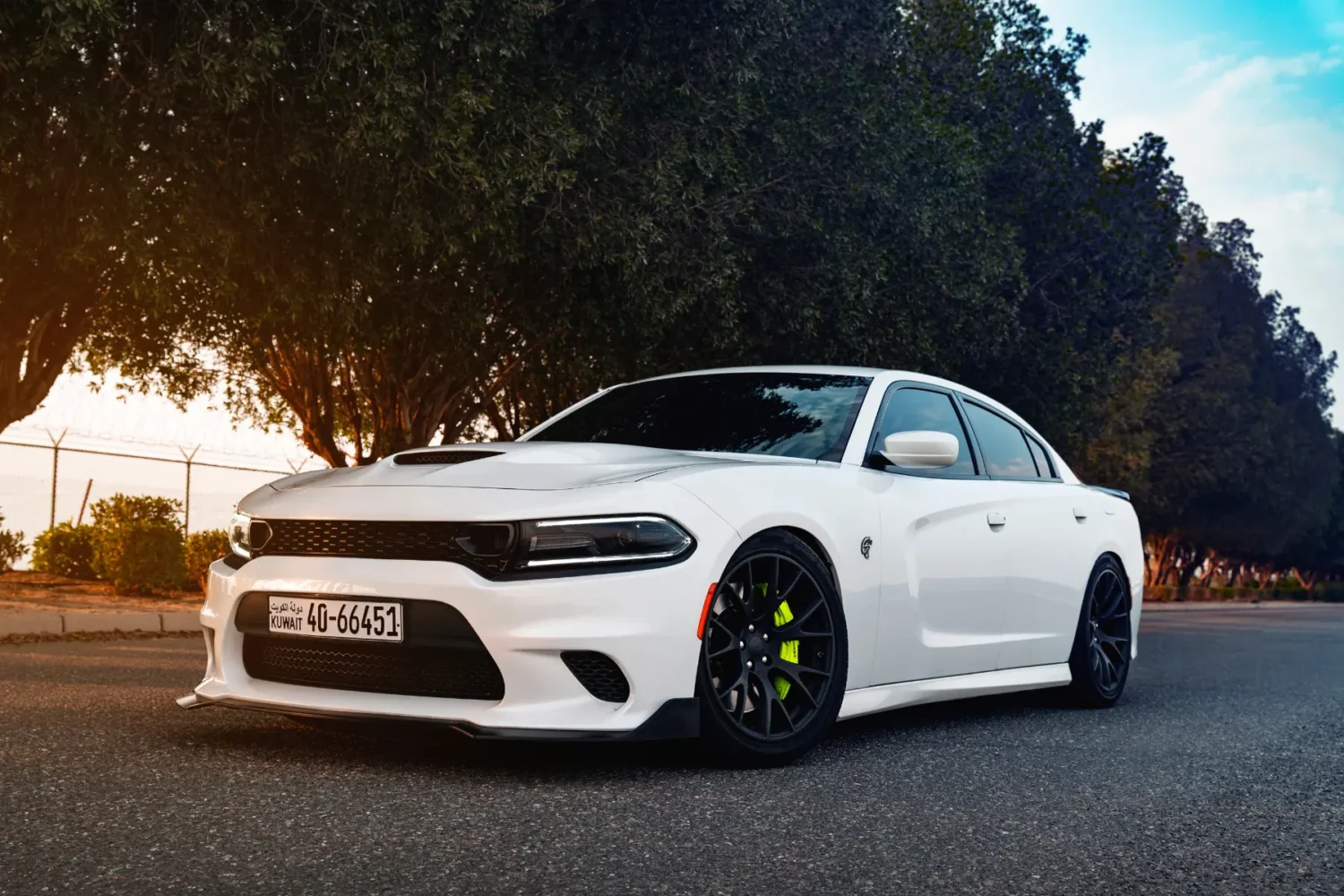 cool auto accessories - JC Whitney Cool auto accessories featured on a white Dodge Charger with black rims and neon brake calipers.