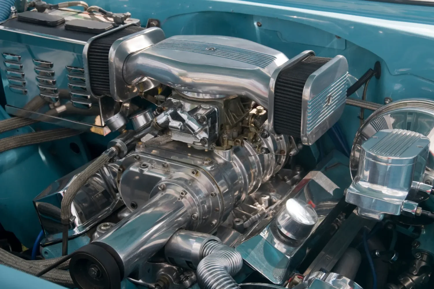 Electric Superchargers - JC Whitney Electric superchargers installed in a polished engine bay of a high-performance vehicle.