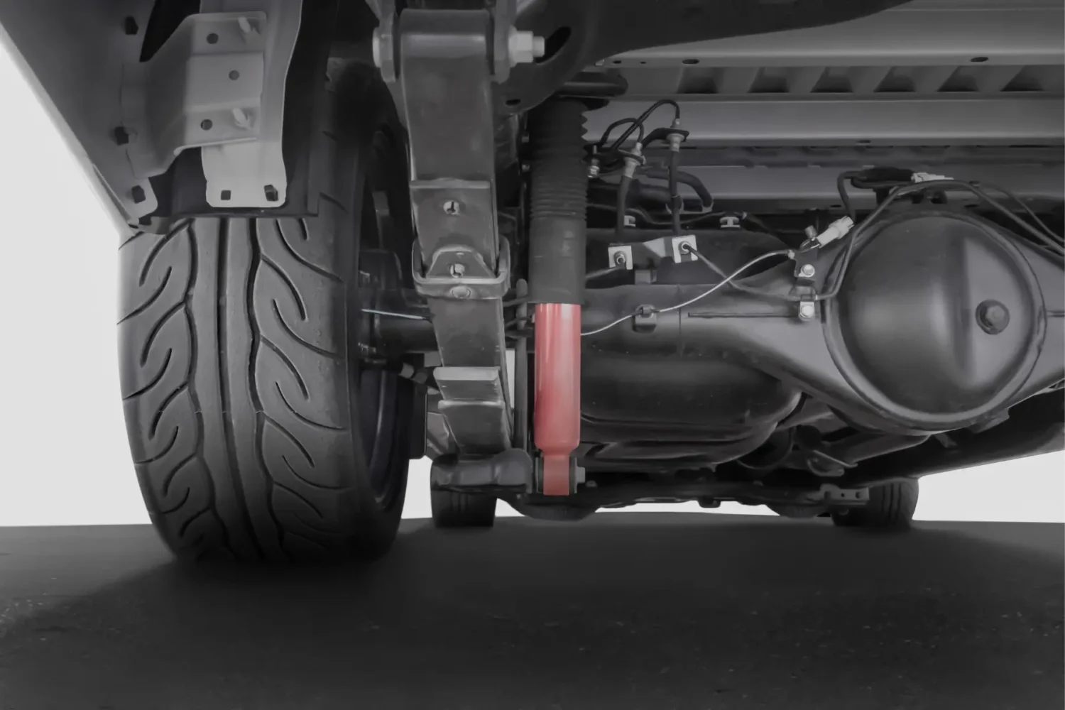 truck suspension upgrades - JC Whitney Truck suspension upgrades visible on a close-up of vehicle undercarriage and shock absorber system